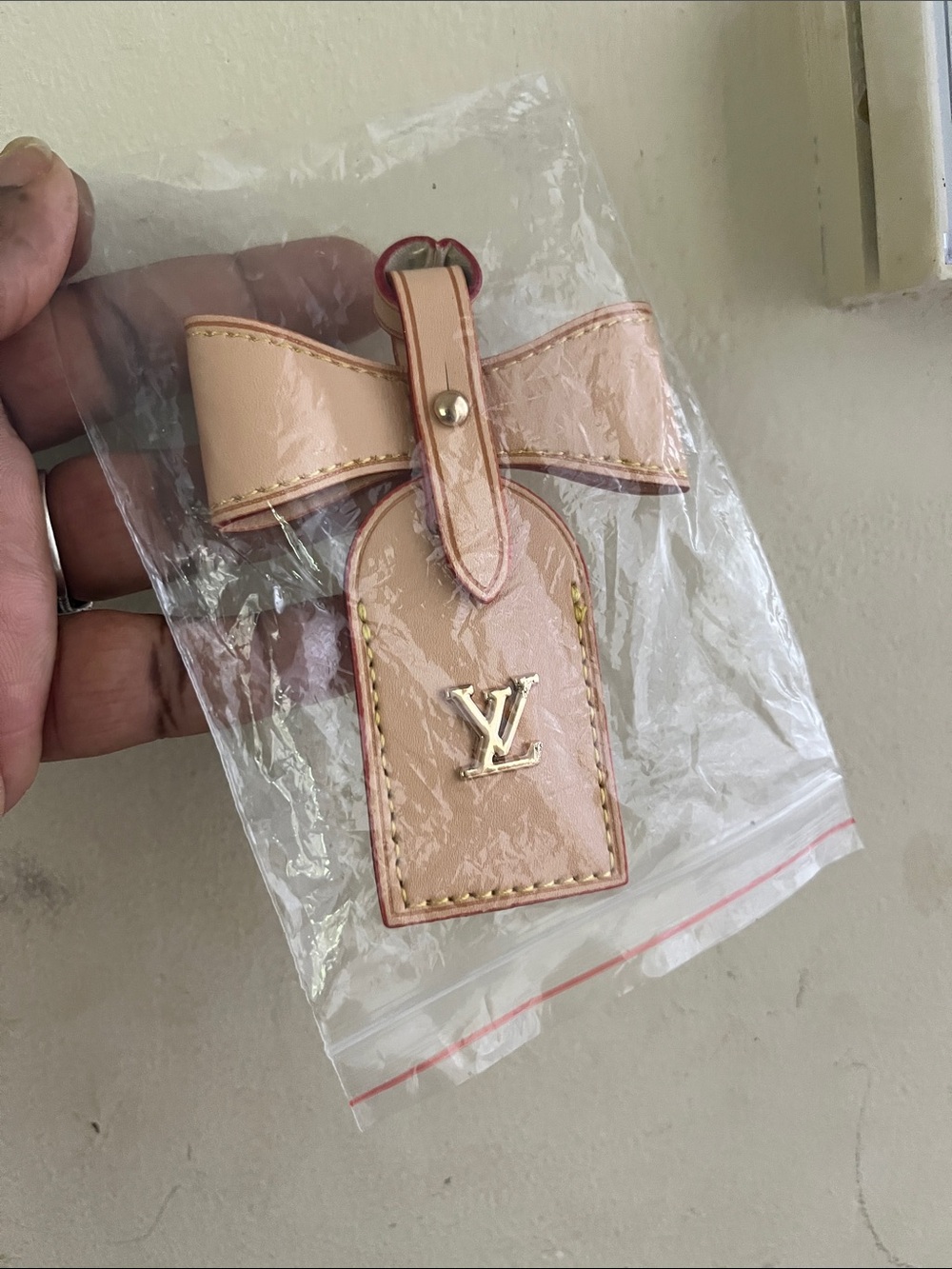 Louis Vuitton Pale Tan Leather Bow Luggage Tag with Gold LV Logo
